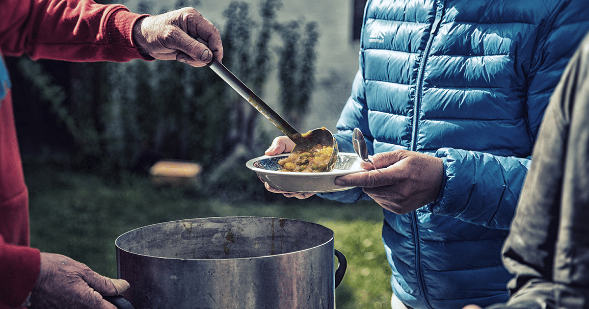 Food being served on a plate outdoors.