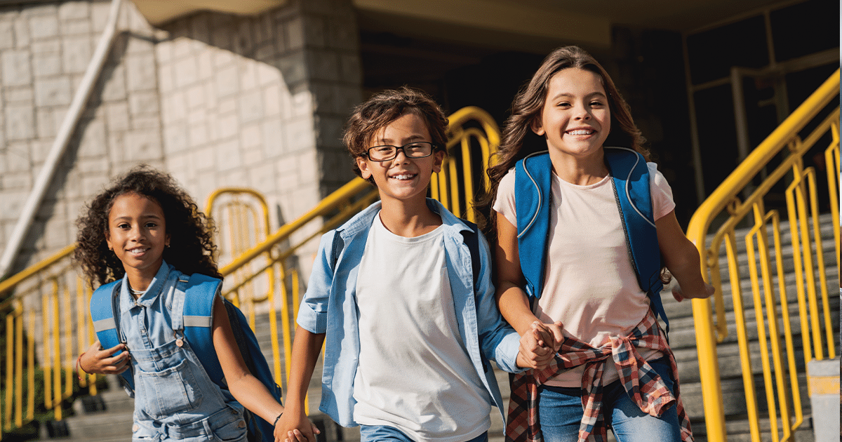 Kids walking together at school.